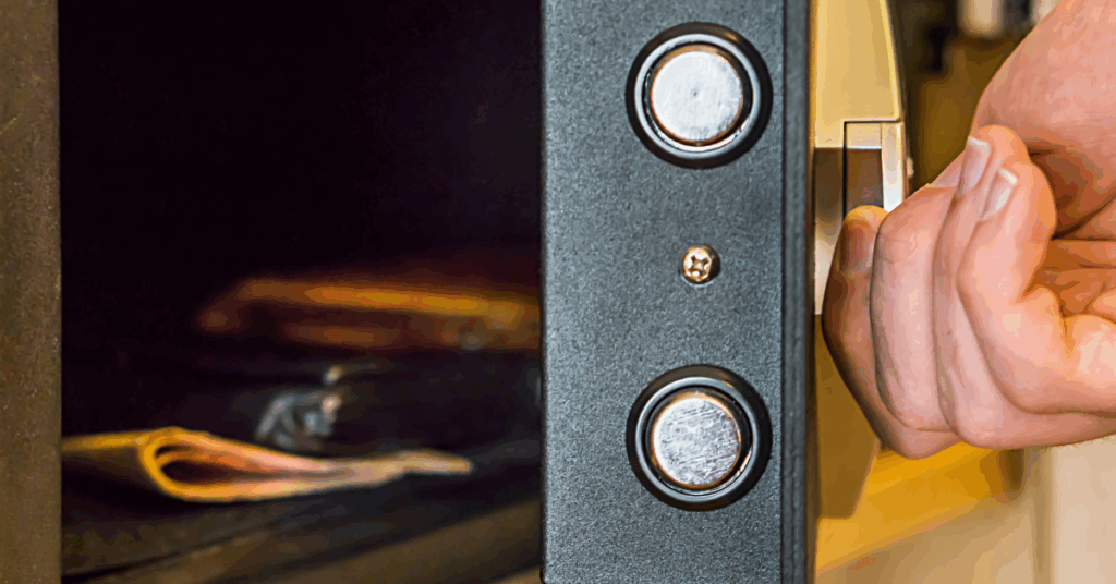 Hand opening a secure safe during a professional safe unlocking service in Oahu